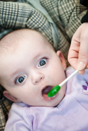 giving candy to a baby